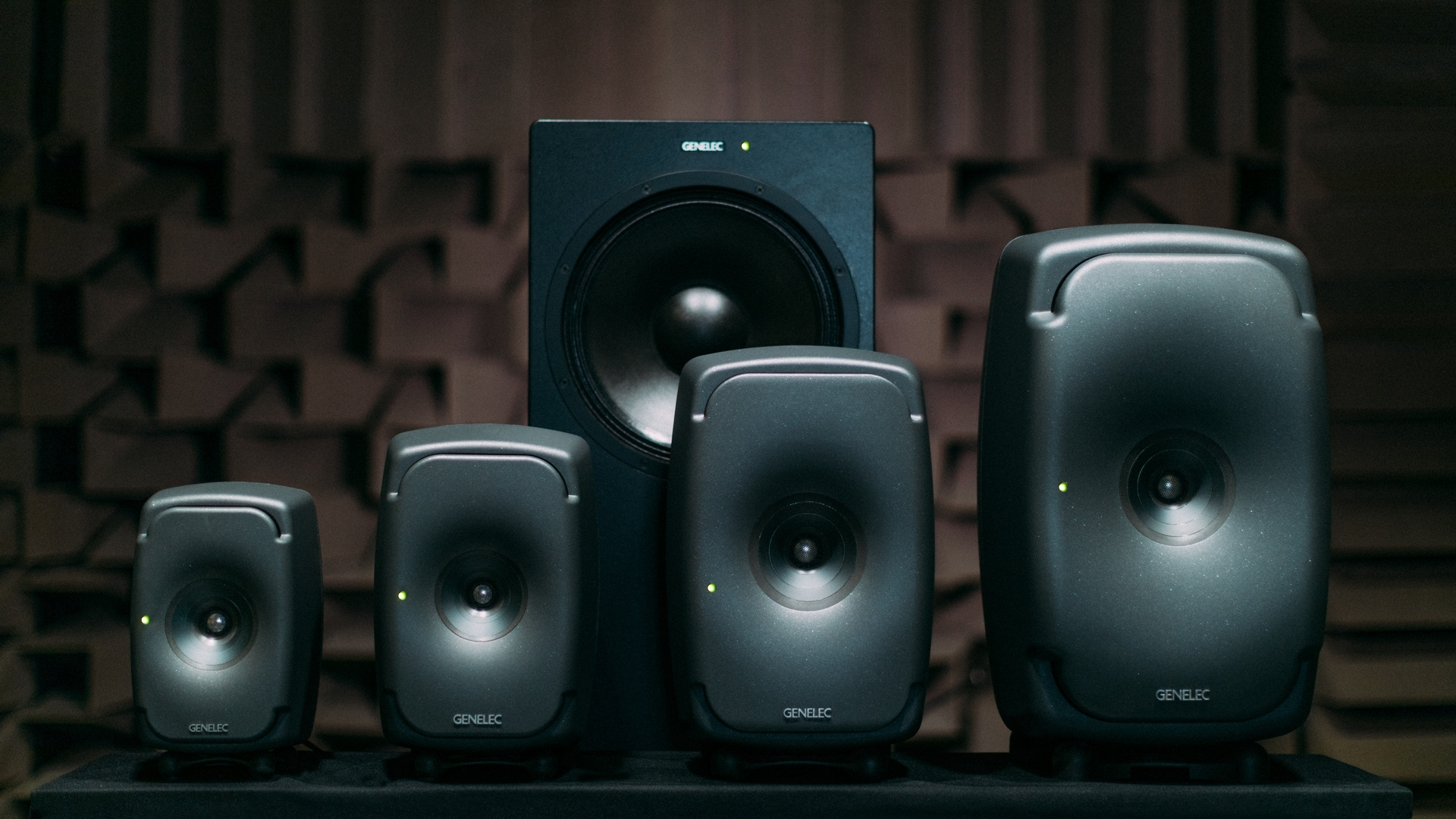 Genelec studio monitor range with subwoofer showing different monitoring sizes for professional audio environments